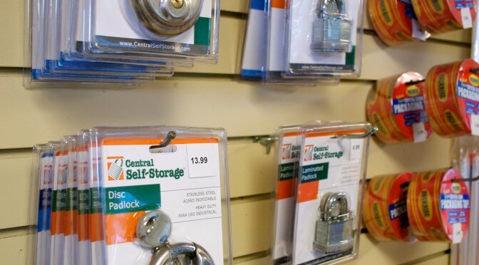 Different types of locks hanging from wall that are available for purchase
