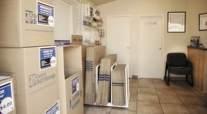 Inside a facility office that has various moving boxes for sale