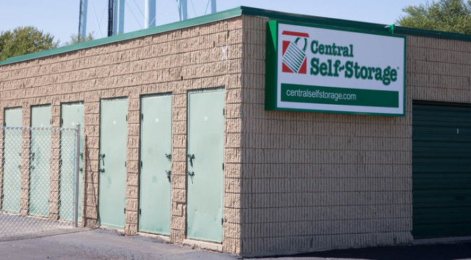 Small outdoor storage units with Central Self Storage signage on side of building