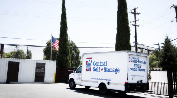 A Central Self Storage moving truck parked outside of facility with a promotion for free truck rental