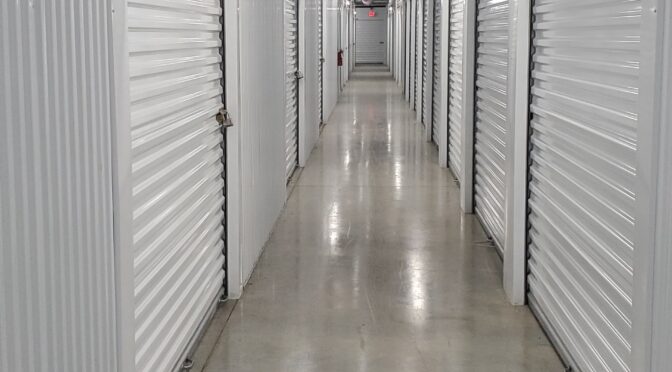 Indoor storage units with white metal doors.