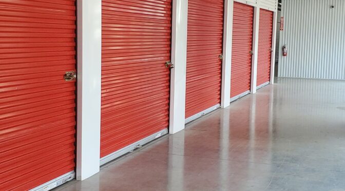 Indoor storage units with red metal doors.