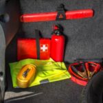 A well-stocked emergency kit in the trunk of a car.