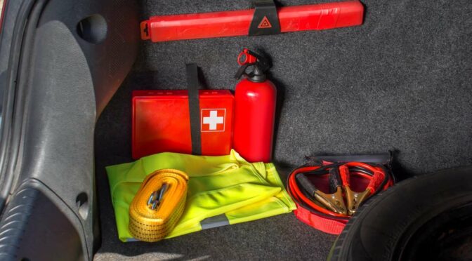 A well-stocked emergency kit in the trunk of a car.